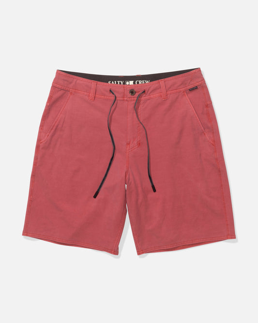 The Salty Crew Transom 19" Overdye Short in Baked Apple features 4-way stretch fabric, side pockets, a black drawstring waist, and an inner label, shown against a white background.