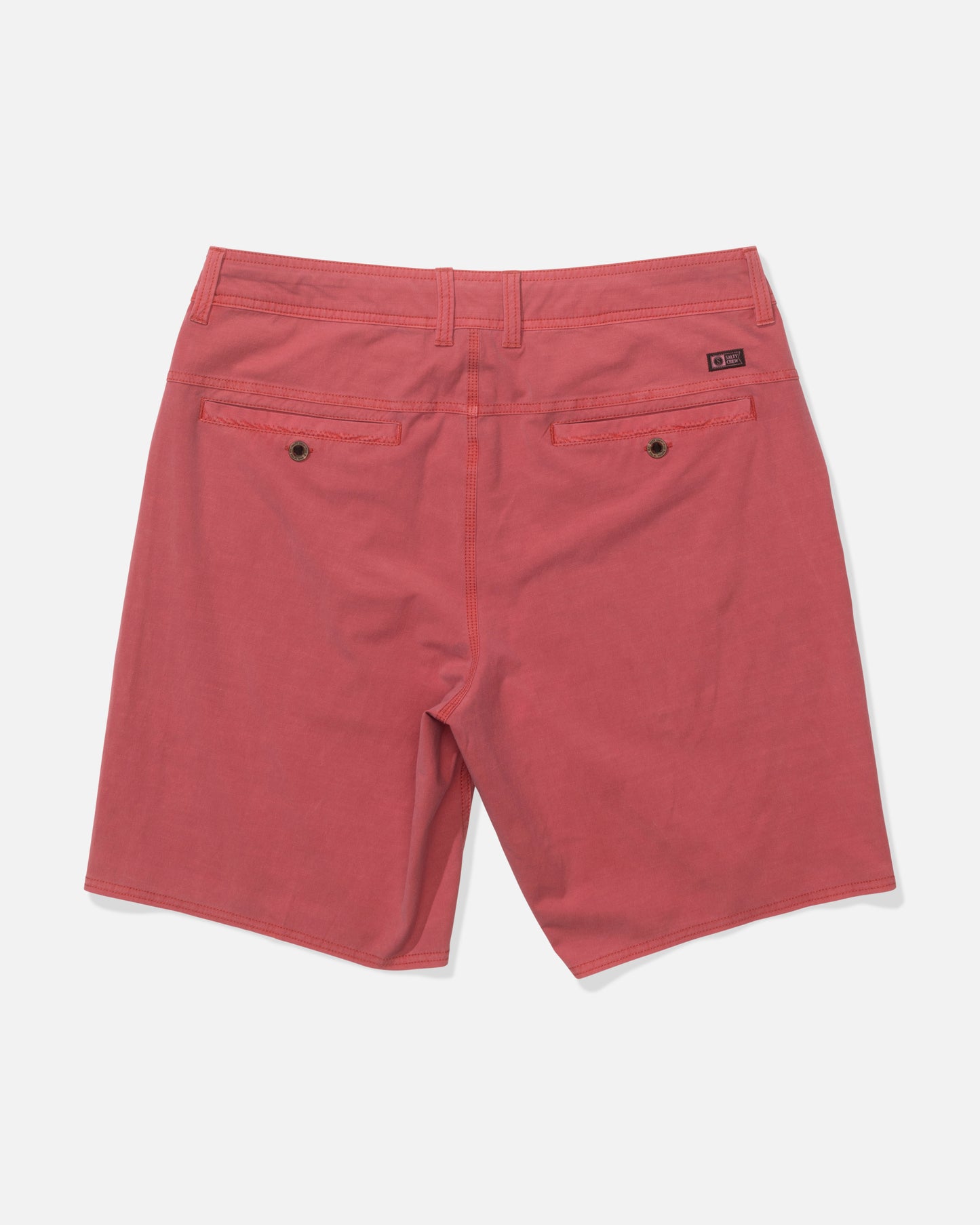 Back view of Salty Crew's Transom 19" Overdye Short in Baked Apple, featuring 4-way stretch fabric, two buttoned back pockets, and belt loops, displayed on a plain white background.