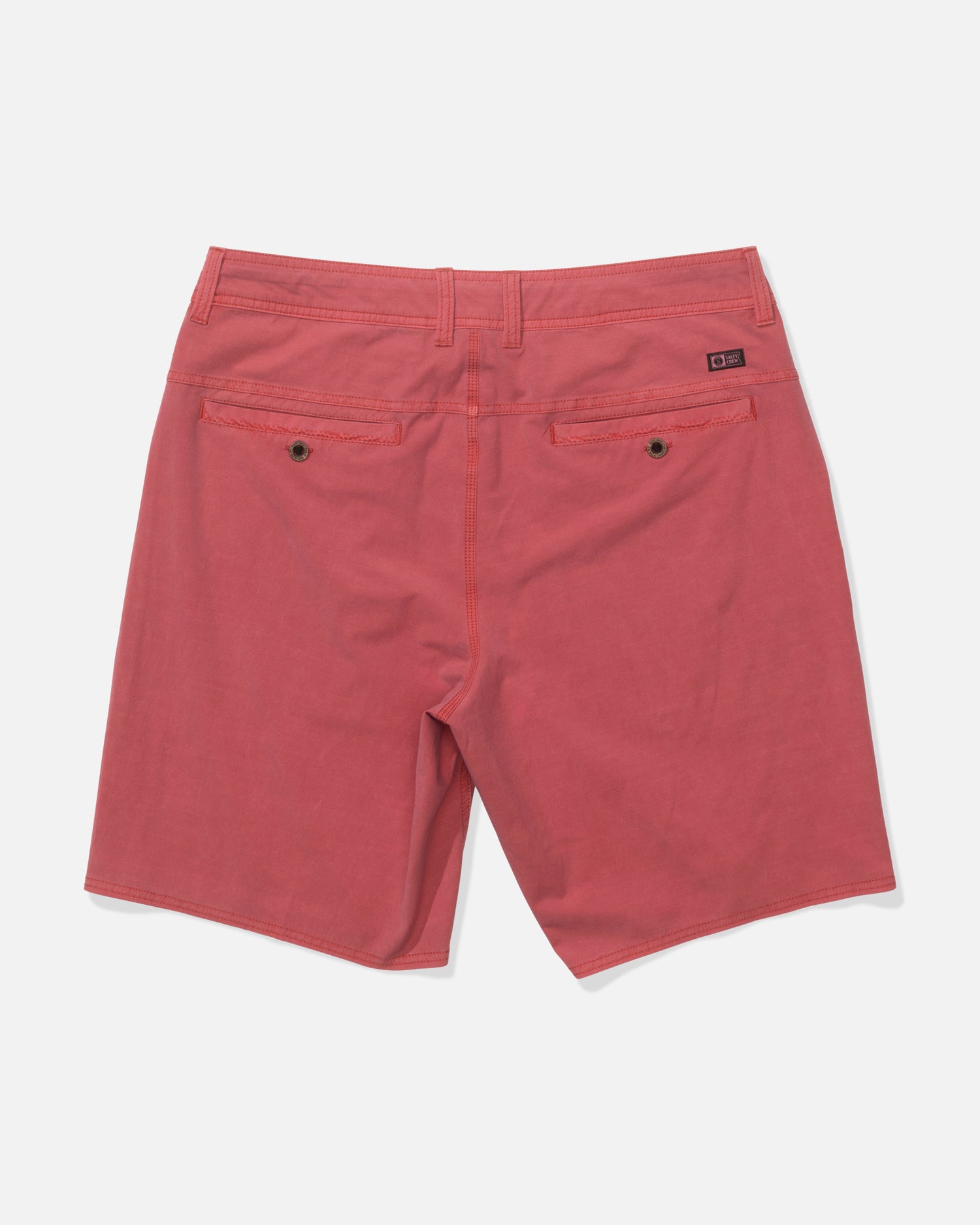 Back view of Salty Crew's Transom 19" Overdye Short in Baked Apple, featuring 4-way stretch fabric, two buttoned back pockets, and belt loops, displayed on a plain white background.