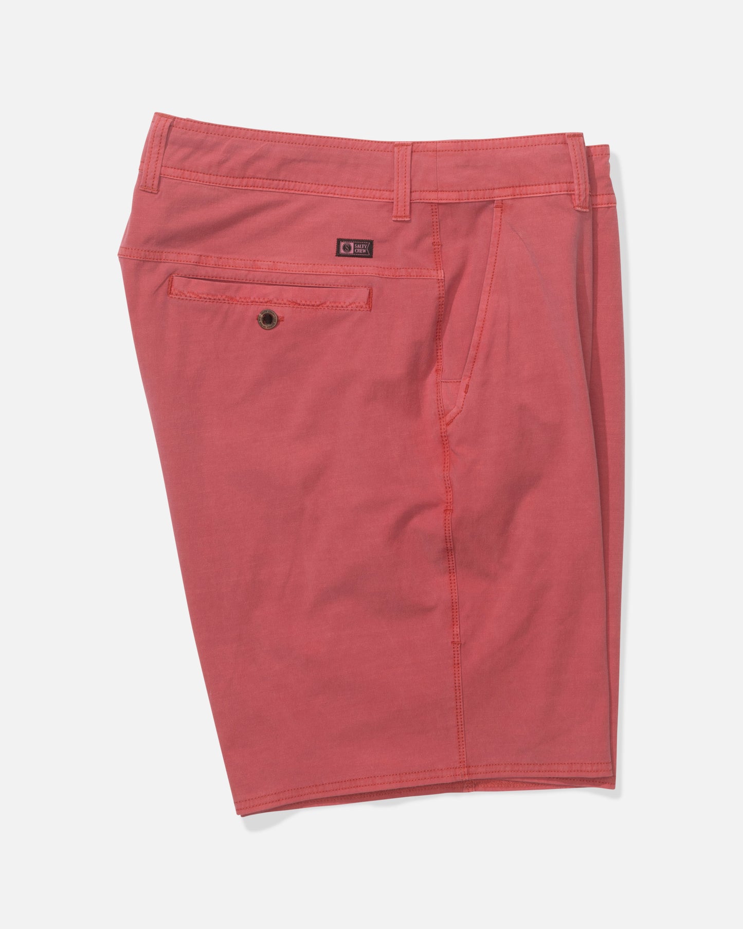 Salty Crew Transom 19" Overdye Short in Baked Apple shown on a plain white background features 4-way stretch fabric, knee-length fit, belt loops, one side pocket, and a back pocket with button closure.