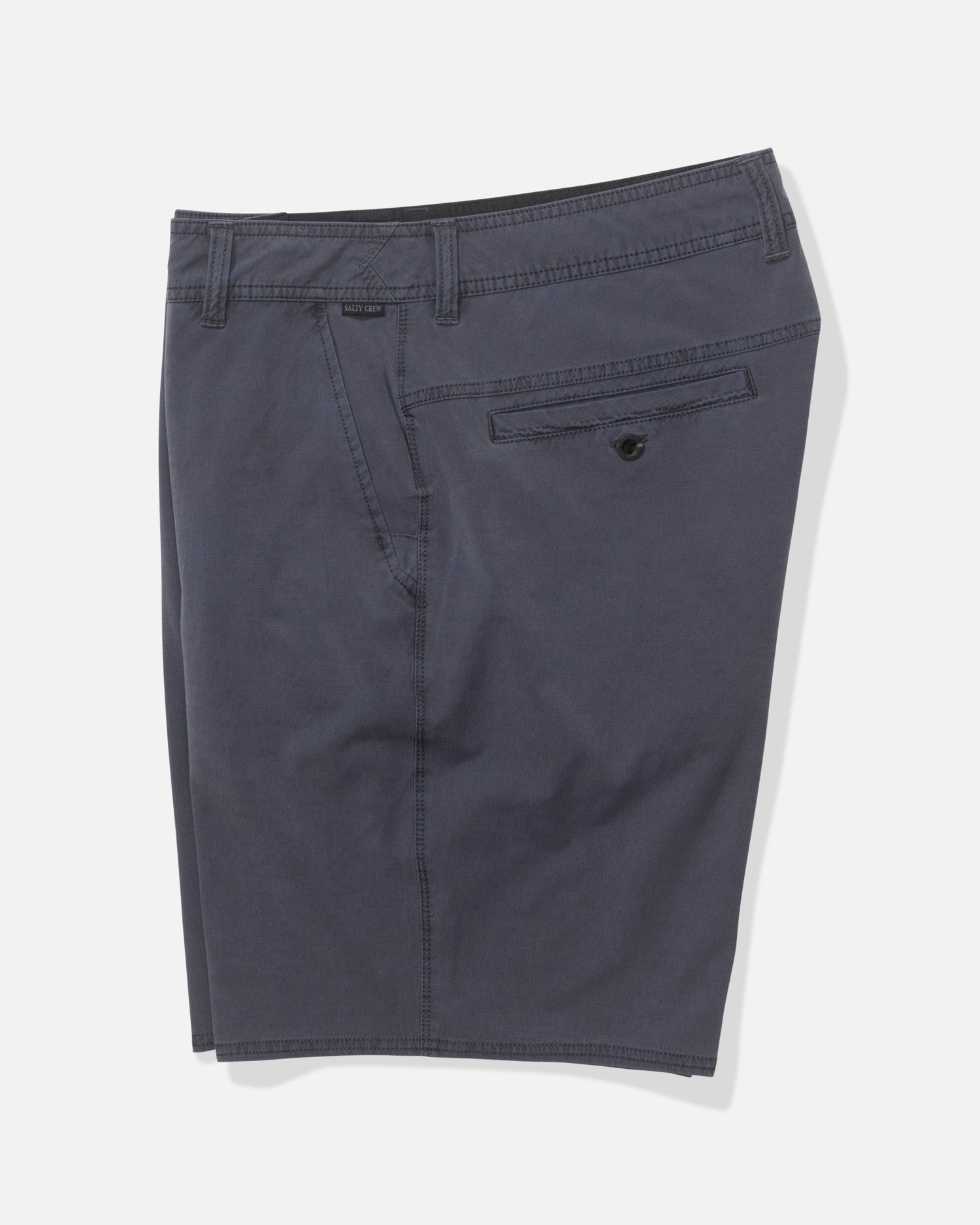 The Salty Crew Transom 19" Overdye Short in Magnet features belt loops, a side pocket, and a buttoned back pocket. Made from quick-dry, 4-way stretch fabric for comfort, shown on a plain white background.