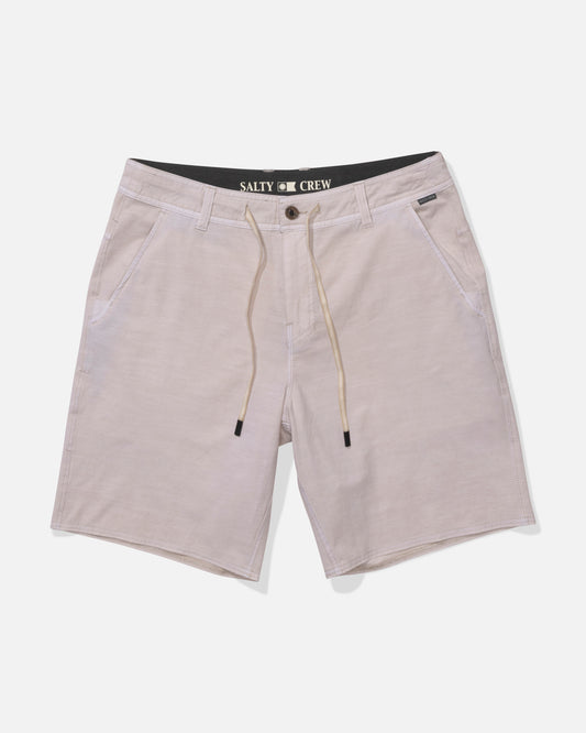 Salty Crew Transom 19" Overdye Short in natural: light beige casual shorts with quick-dry, 4-way stretch fabric, side pockets, drawstring waist, belt loops, and an inner Salty Crew label, shown on a white background.
