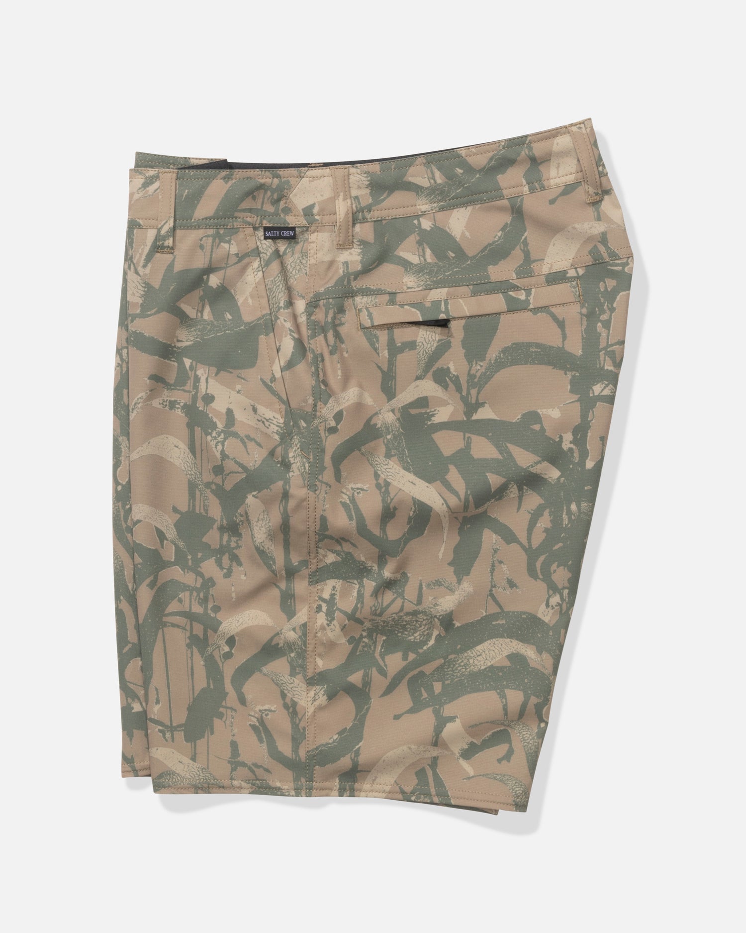 The Salty Crew Transom 19" Tech Short in Kelp Camo features a tan and olive camouflage pattern, lightweight stretch fabric, belt loops, front zipper, and back pocket, shown flat against a white background.