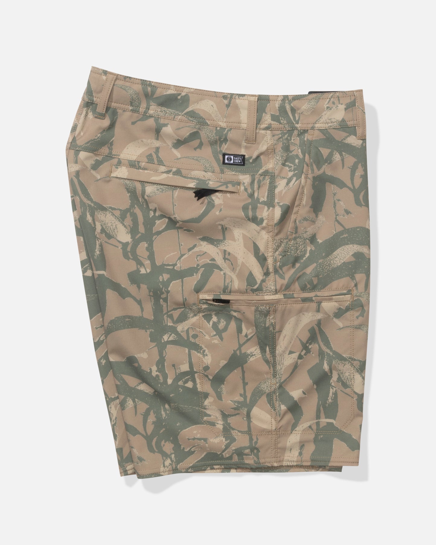 The Salty Crew Transom 19" Tech Short in Kelp Camo features a tan and green camouflage pattern, lightweight stretch fabric, and multiple zippered pockets, shown flat on a white background.
