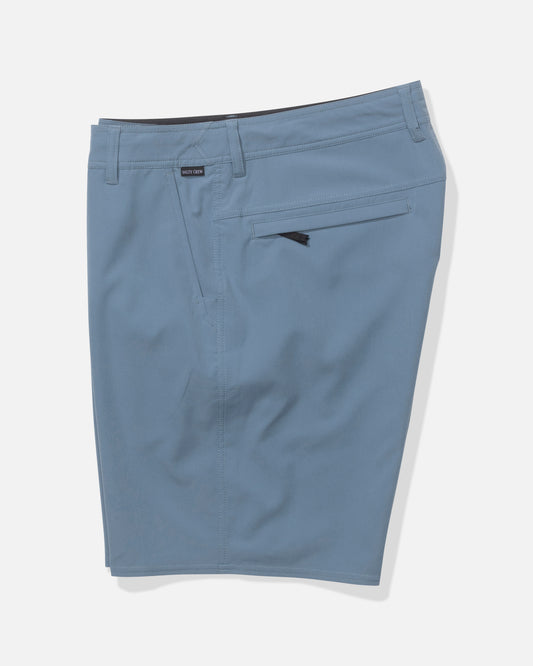 The Salty Crew Transom 19" Tech Short in Pilot Blue features a knee-length fit, zipper fly, belt loops, back zippered pocket, and a minimalist design—crafted from lightweight fabric for comfort. Shown against a white background.