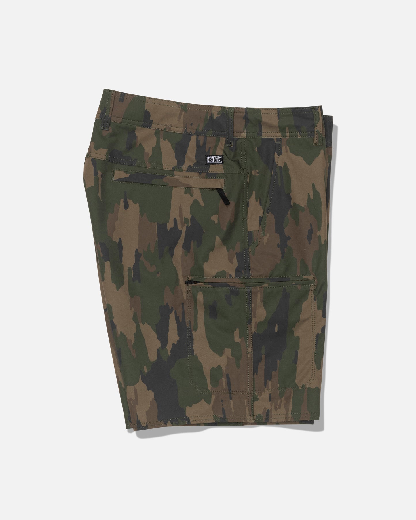 The Salty Crew Transom 19″ Tech Short - Ranger is a pair of green and brown camouflage-patterned straight leg shorts, made from recycled polyester with a zipper pocket, shown folded on a plain white background.