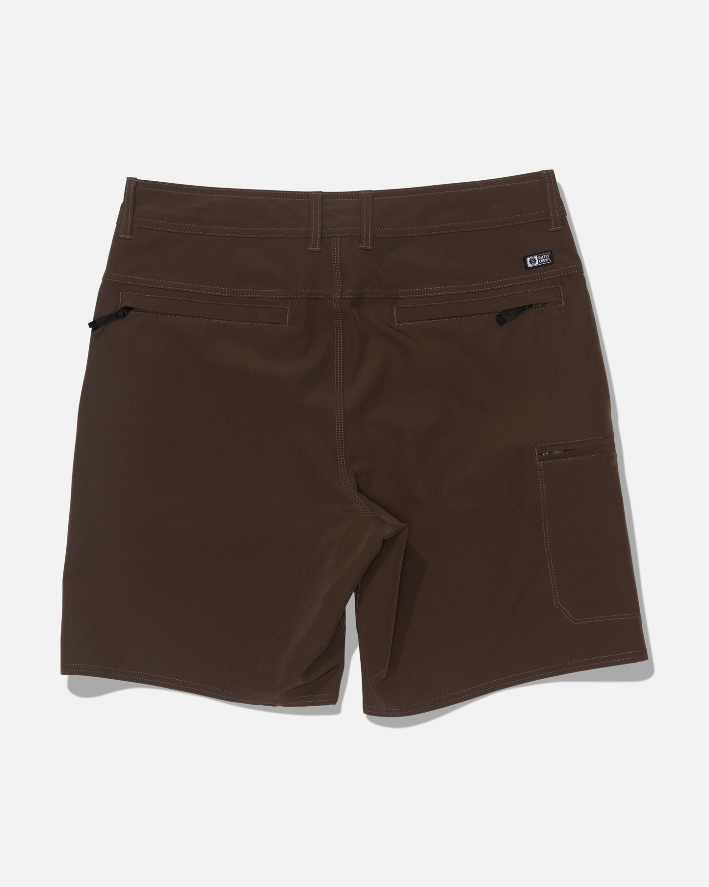 The Salty Crew Transom 19″ Tech Short in Washed Brown is displayed from the back, highlighting zippered rear pockets and a small side pocket. Made from quick-drying, durable material, these shorts are ideal for outdoor activities.