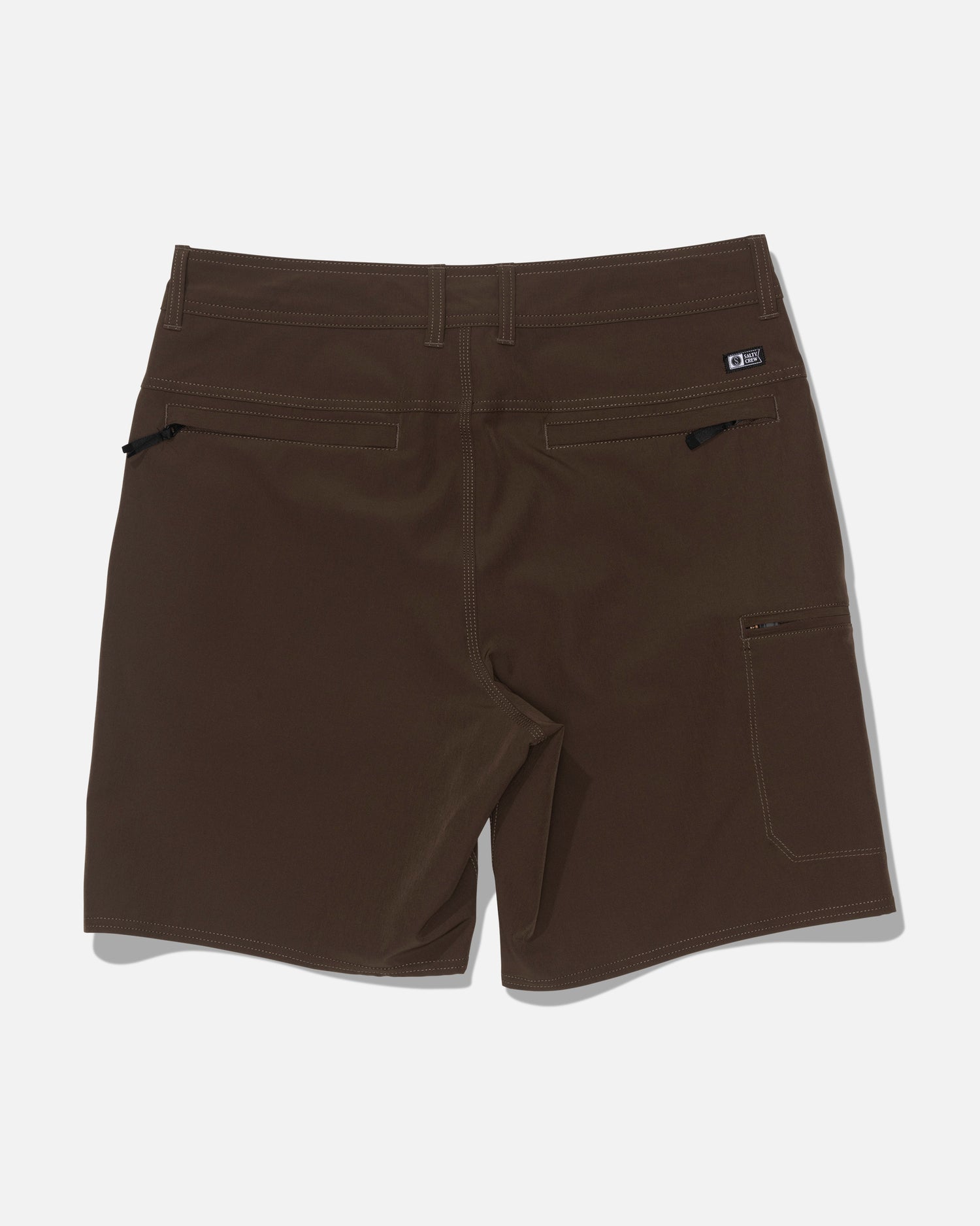 The Salty Crew Transom 19″ Tech Short in Washed Brown is displayed from the back, highlighting zippered rear pockets and a small side pocket. Made from quick-drying, durable material, these shorts are ideal for outdoor activities.