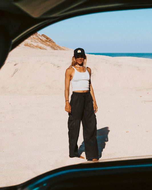 On-body lifestyle shot of the Driftwood Pant - Black. 