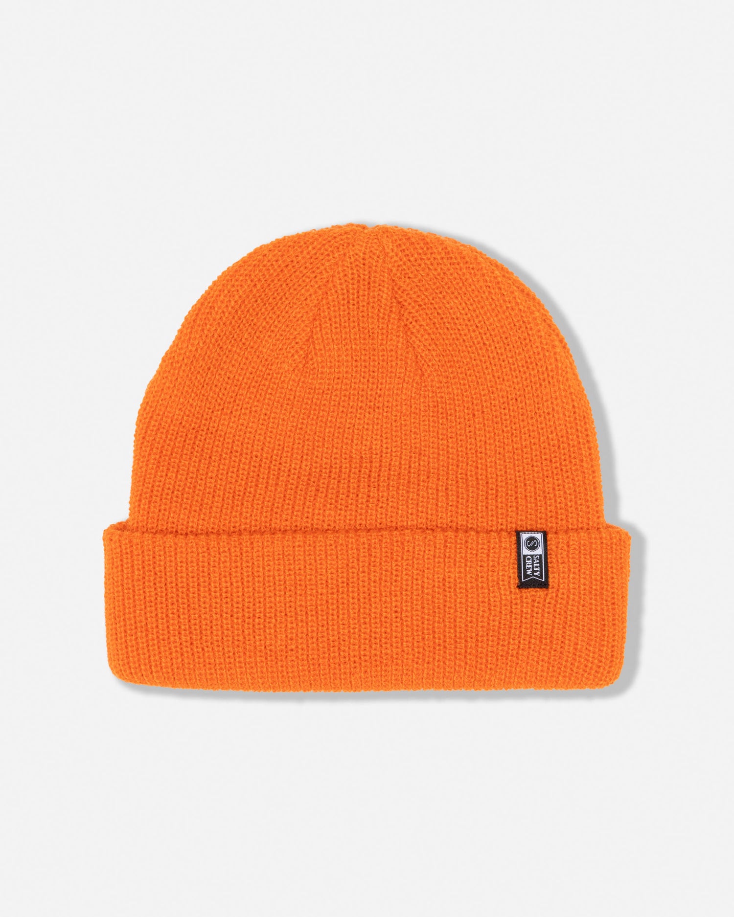The Salty Crew Alpha Beanie – Koi showcases a vibrant orange acrylic design with classic six dart construction and a folded brim, completed by a small black and white woven label on the cuff, shown against a plain white background.