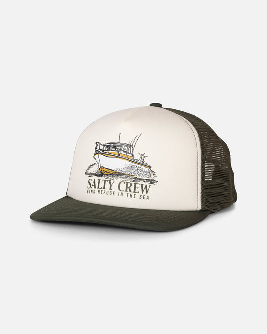 The Salty Crew Good Times Foamie Trucker in Deep Green is a structured 5 panel trucker hat with a foam-backed cotton twill front, white mesh back, and an adjustable plastic snapback closure. The front features an illustration of a fishing boat along with the words “Salty Crew Find Refuge in the Sea.”.