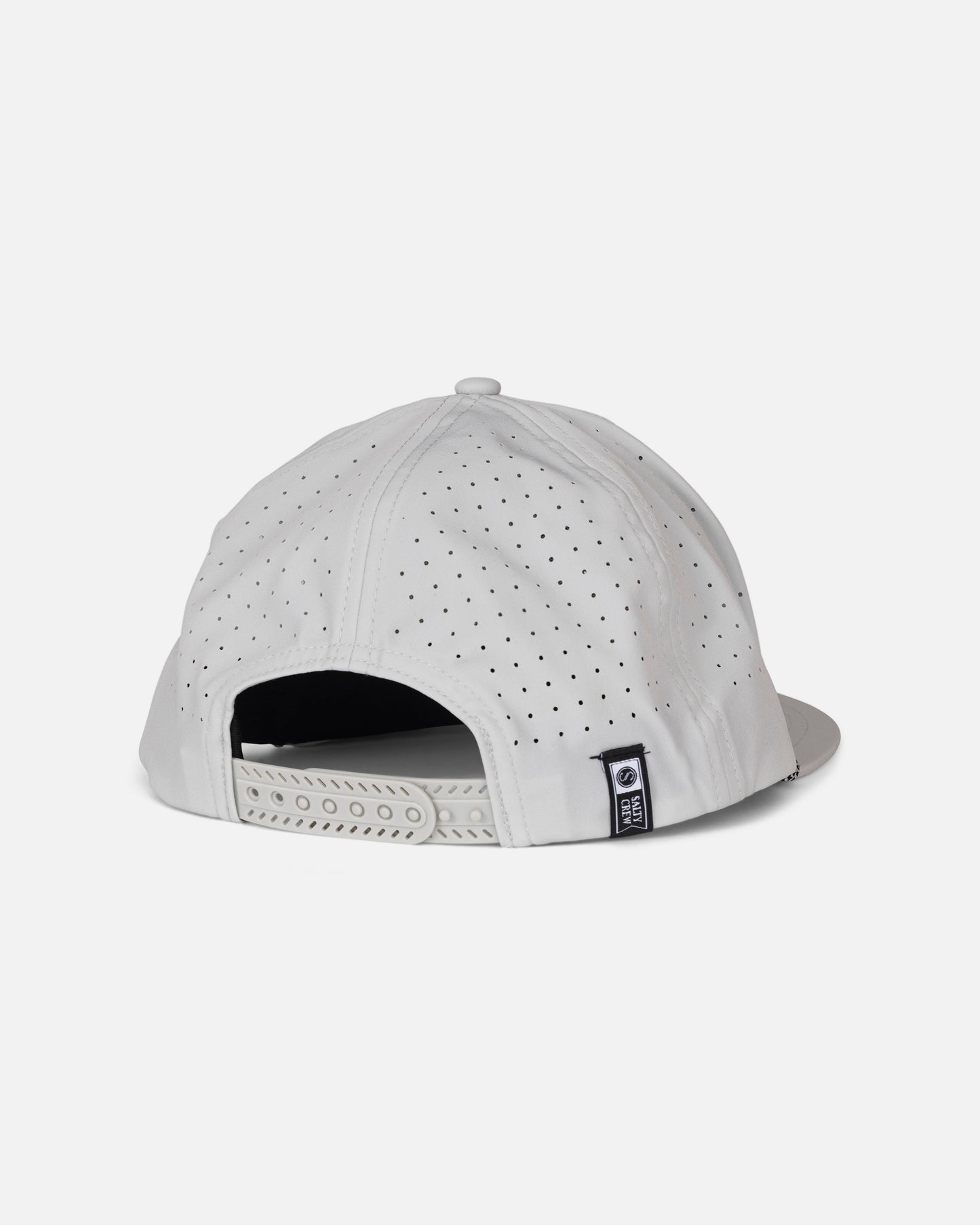 The Long Range Snapback - Harbor Grey by Salty Crew is a white polyester structured cap, displayed from the back, highlighting its small ventilation holes, adjustable snapback strap, and a small black and white Salty Crew label on the side.