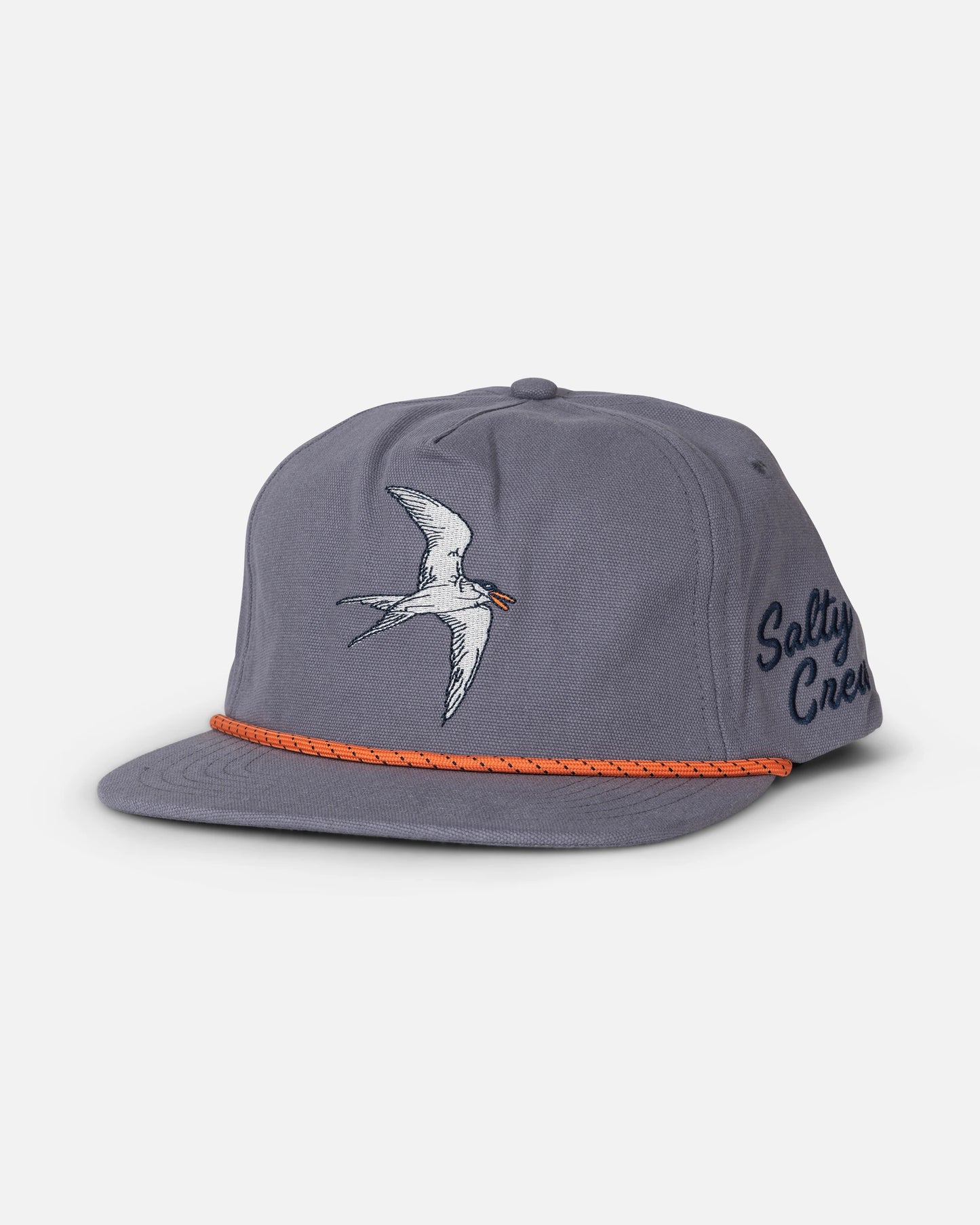 Certainly! Here’s a rewritten version using your product data: The Salty Crew Coastal Snapback in Hitch Blue is a 5-panel cotton canvas cap featuring an embroidered white bird on the front and “Salty Crew” stitched in navy on the side. An orange braided rope accent along the brim adds a signature touch.