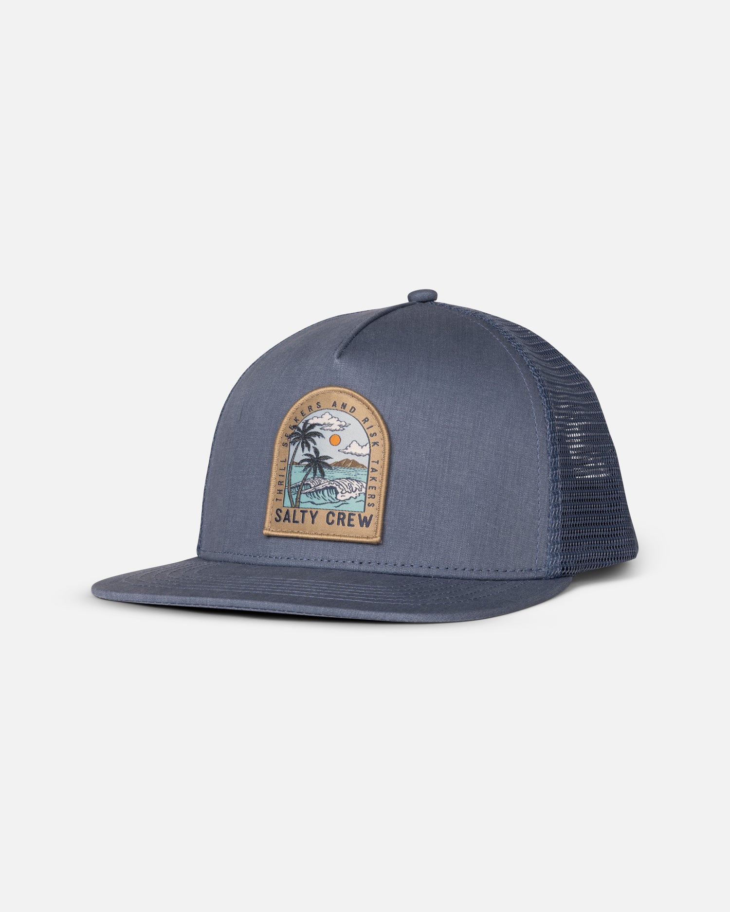 The Salty Crew Archway Boys Trucker in Pilot Blue features a mesh back, flat brim, snapback closure, and a front patch with palm tree, ocean waves, sun, and "Salty Crew: Thrill Seekers and Risk Takers" text.