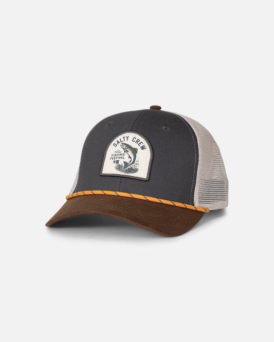 The Salty Crew Fishing Club Trucker - Grey/Brown is a mesh trucker snapback hat featuring a grey cotton twill front, brown brim, yellow stitched detail, and a woven patch with “Salty Crew” and a fish graphic.