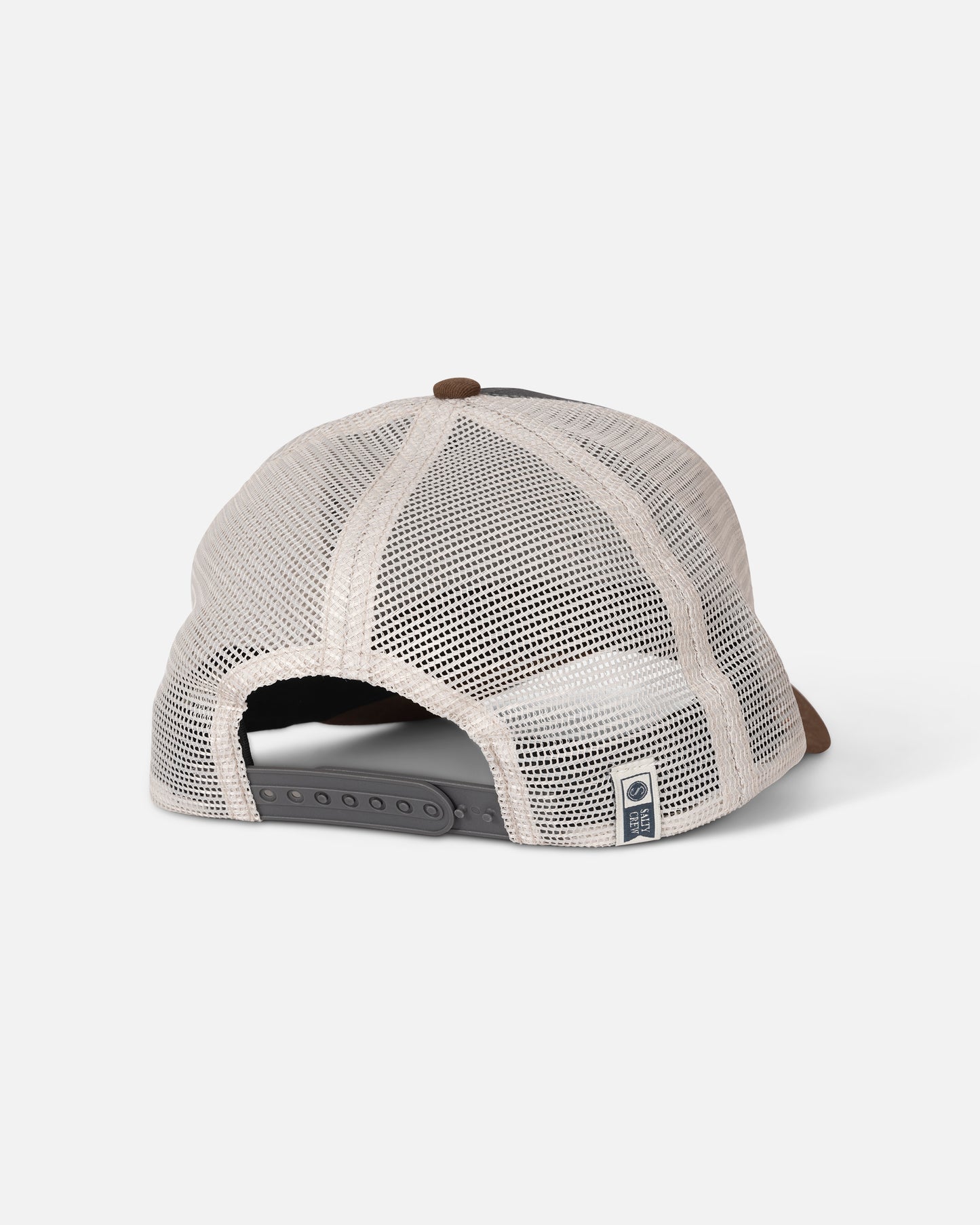 The Salty Crew Fishing Club Trucker - Grey/Brown is displayed from the rear, highlighting its beige mesh back panel, adjustable black snap closure, and a small blue and white woven patch tag near the opening. Crafted with a blend of mesh and cotton twill for comfort and durability, this classic trucker hat embodies timeless style.