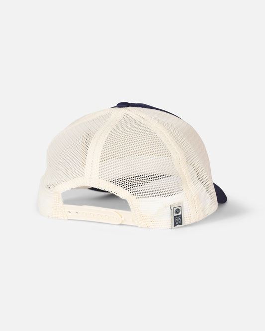 The Salty Crew Seaside Trucker - Navy is shown from the back, featuring a breathable mesh back panel in navy and white and an adjustable plastic snap closure.