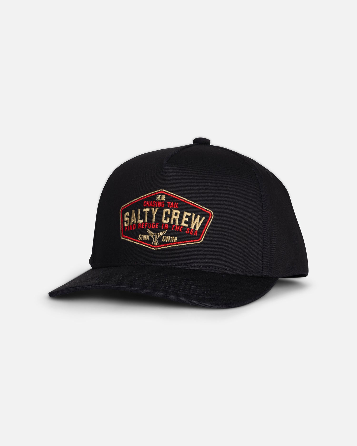 The Tailfin Boys Snapback - Black by Salty Crew is a black cotton 5-panel hat featuring a red and yellow embroidered patch on the front that reads “Salty Crew” and “Chasing Tail.” The snapback cap is photographed against a plain white background.