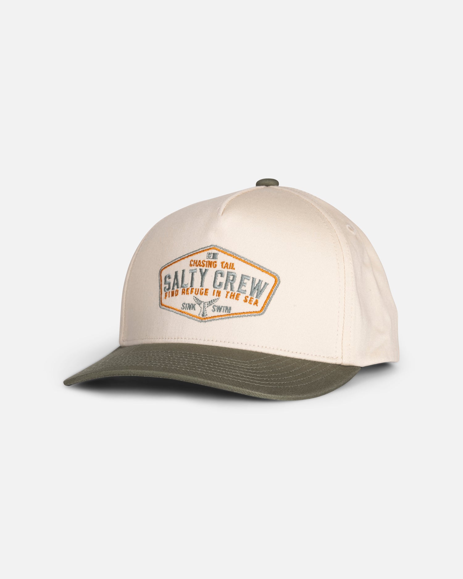 The Tailfin Boys Snapback by Salty Crew features an off white crown with a green brim, adorned with a diamond-shaped Salty Crew patch on the front and other subtle text details. Crafted from cotton in a high crown snapback style, this cap stands out against a plain white background.
