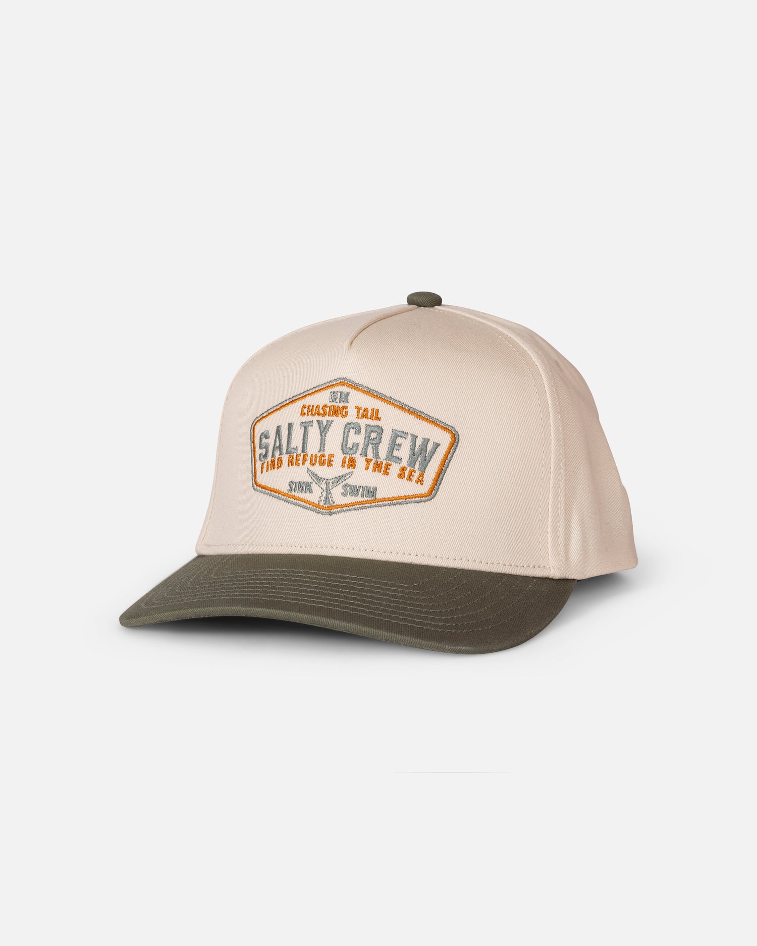 The Tailfin Snapback by Salty Crew in Off White/Green is a cotton 5 panel cap featuring a patch with “Salty Crew: Find Refuge in the Sea” and a fish graphic. Displayed on a white background, this classic snapback offers an adjustable fit for comfort and style.