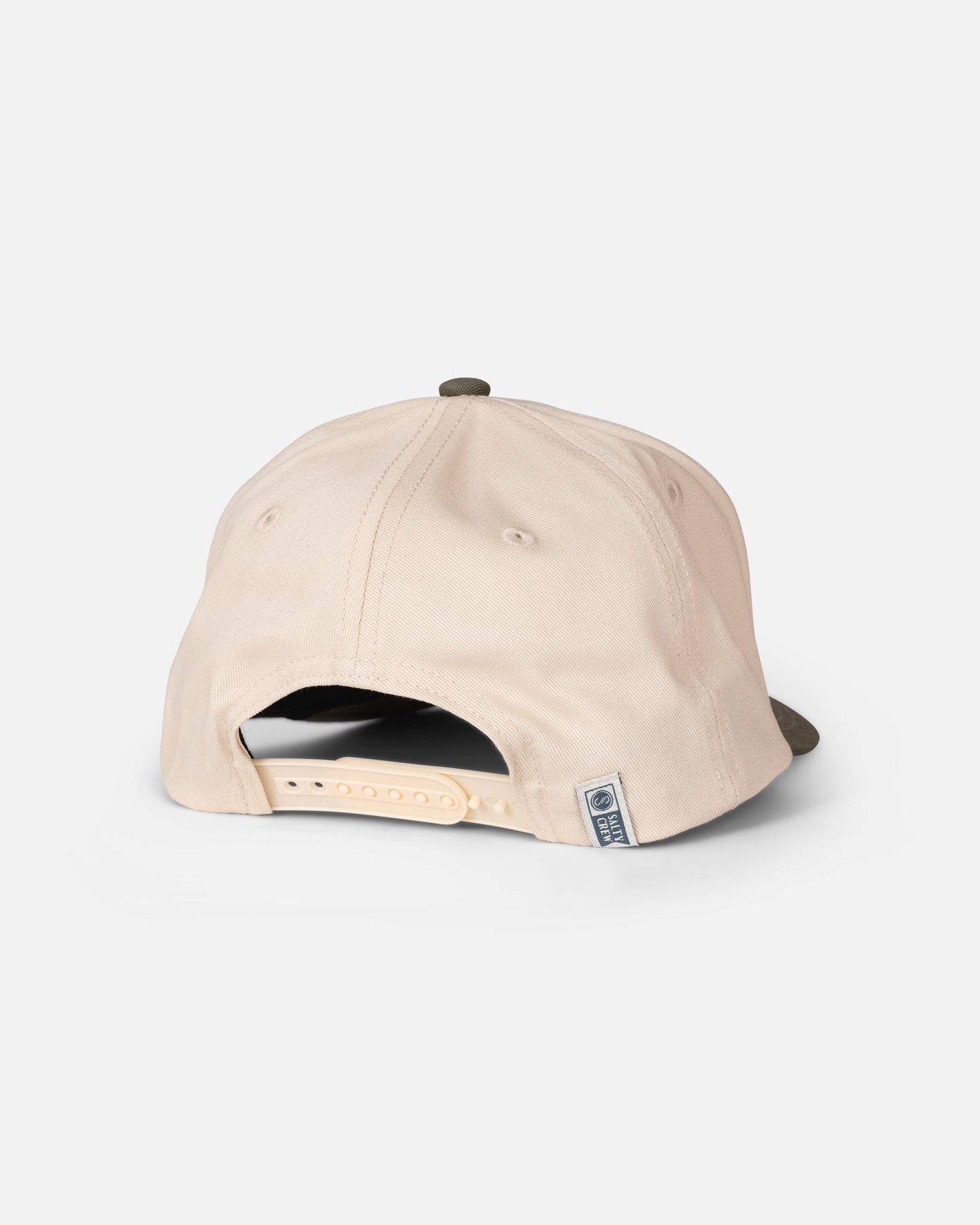 The Salty Crew Tailfin Boys Snapback in Off White/Green is a high-crown baseball cap viewed from the back, featuring an adjustable cotton snapback closure and a small rectangular fabric tag on the bottom right side.