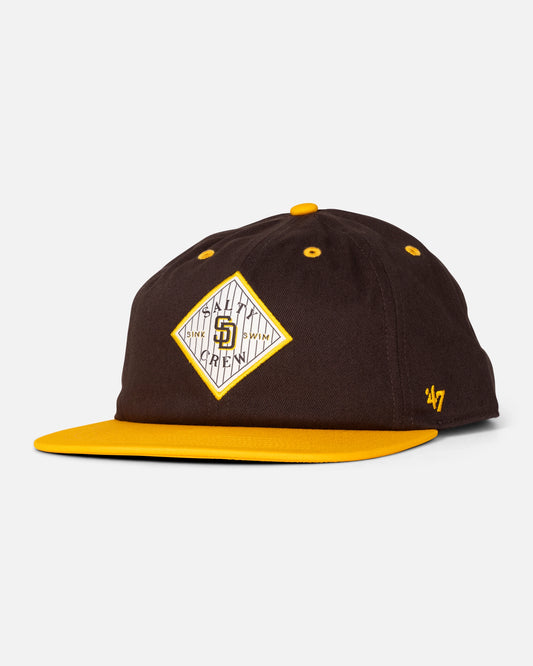 The Padres Tippet Hat - Brown / Gold by Salty Crew is a limited edition San Diego Padres cap featuring a brown crown, gold brim, and a diamond-shaped team logo on the front.