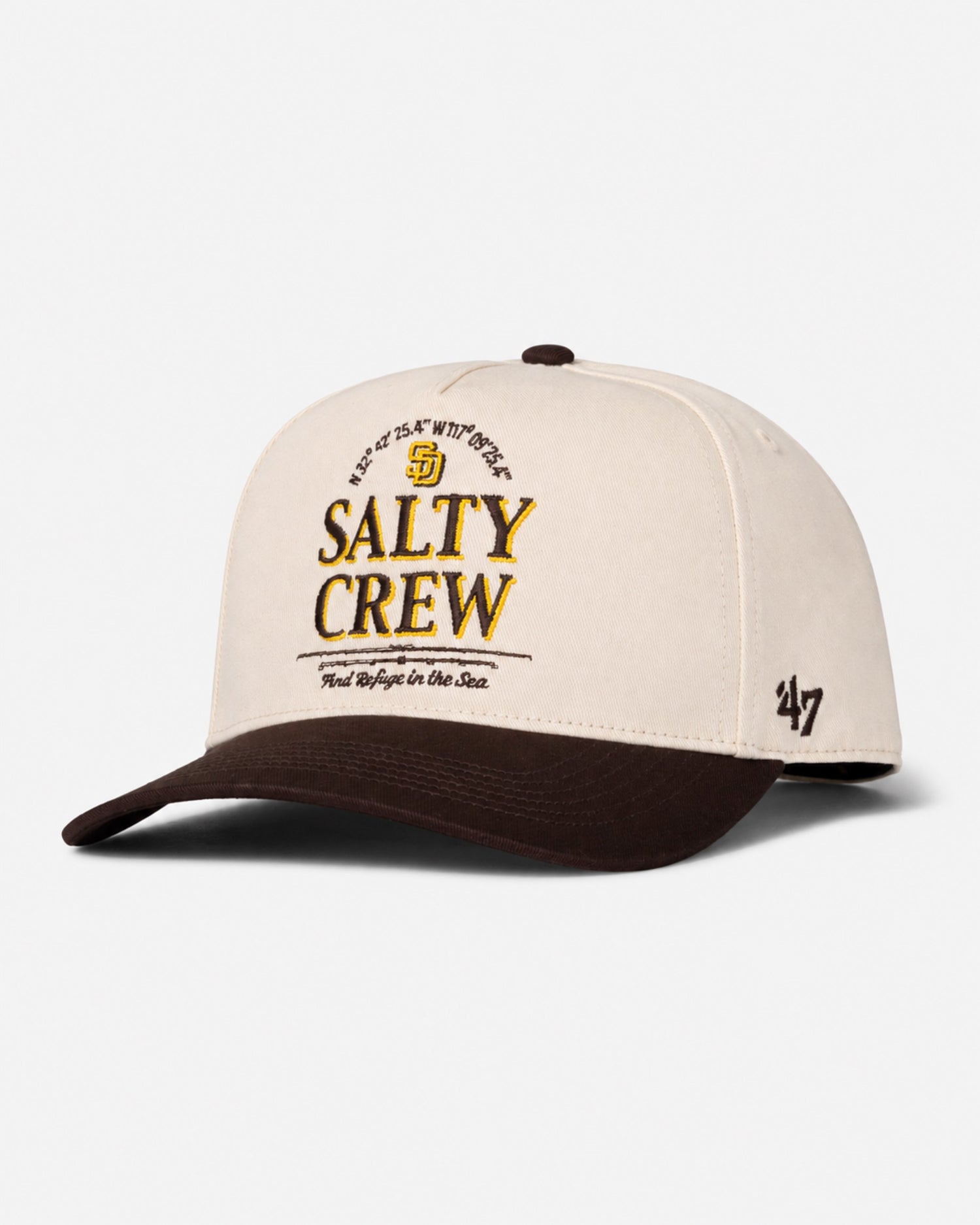 The Padres Label Hat - Bone from Salty Crew features a beige and brown design with an embroidered Salty Crew anchor logo on the front, plus the number 47 stitched on the side, bringing a limited edition ’47 Brand style to your look.