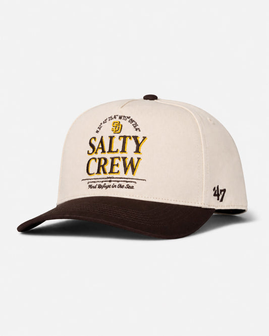 The Padres Label Hat - Bone from Salty Crew features a beige and brown design with an embroidered Salty Crew anchor logo on the front, plus the number 47 stitched on the side, bringing a limited edition ’47 Brand style to your look.