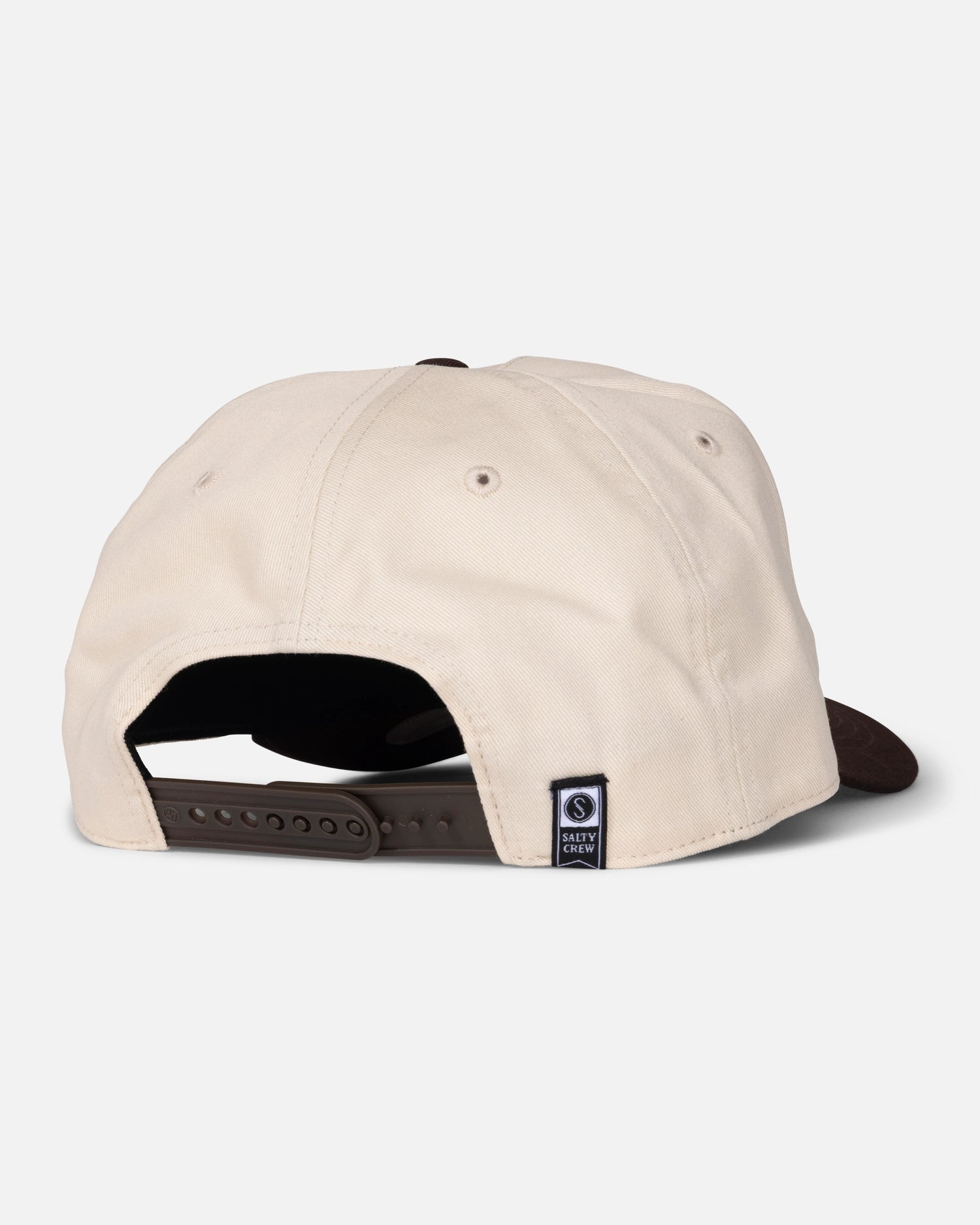 A bone-colored Padres Label Hat by Salty Crew is shown from the back, featuring a brown adjustable strap and a small navy blue woven label near the opening. The background is plain white.