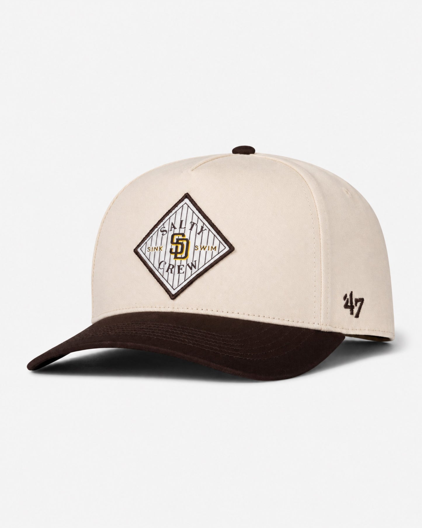 A bone-colored Padres Tippet Hat from Salty Crew, this limited edition cap features a diamond-shaped team logo patch on the front and a small Salty Crew logo on the left side.