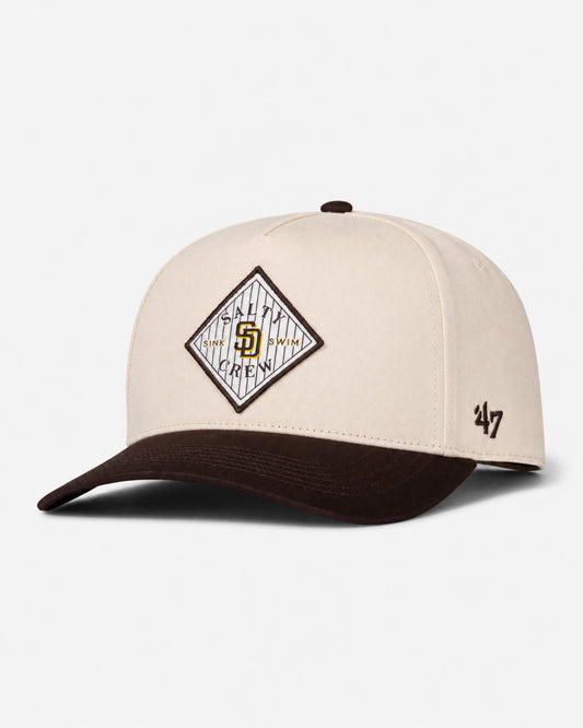 A bone-colored Padres Tippet Hat from Salty Crew, this limited edition cap features a diamond-shaped team logo patch on the front and a small Salty Crew logo on the left side.