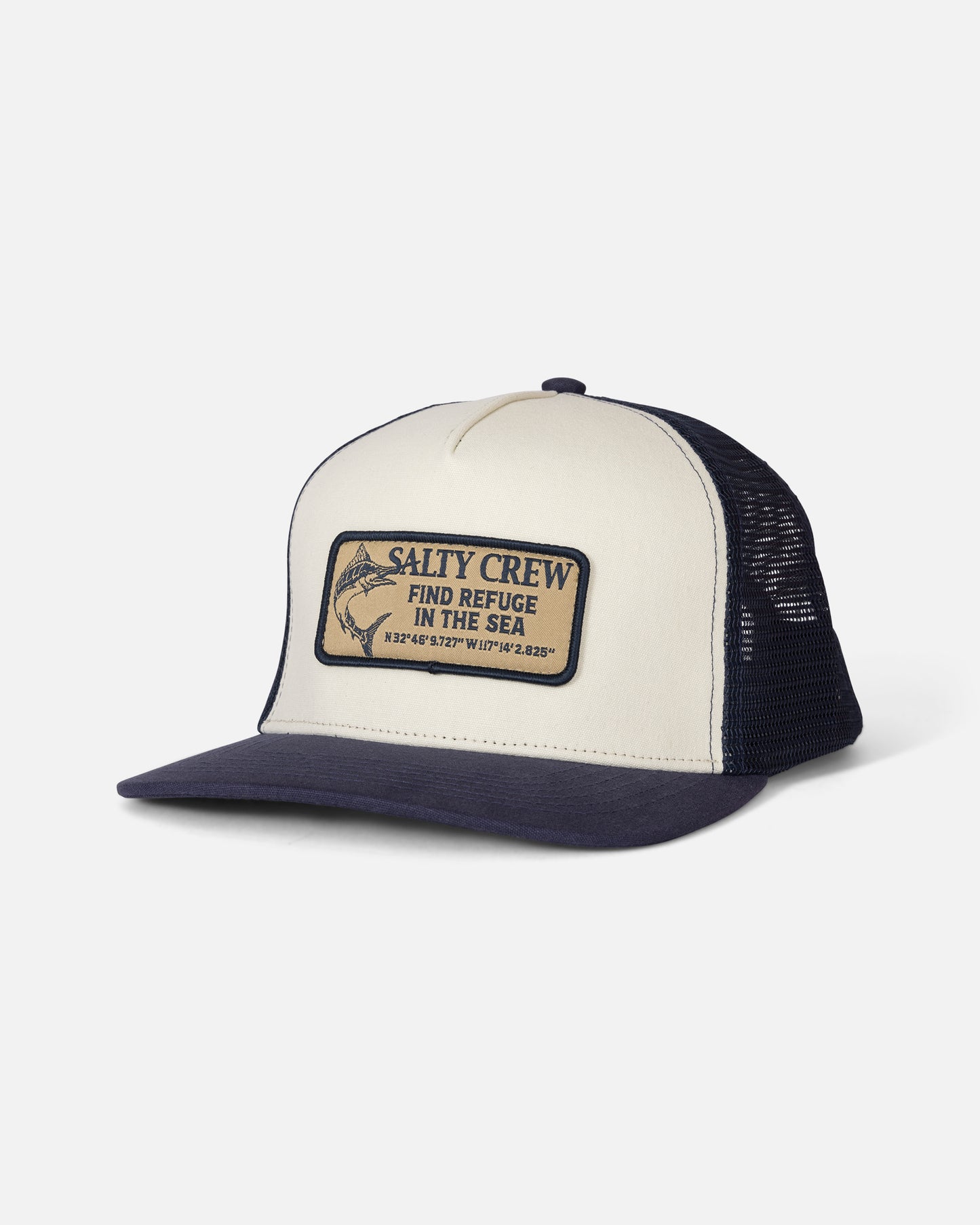The Salty Crew Coordinates Trucker in Off White/Navy is a high crown, 5 panel cap featuring a mesh back and an adjustable cotton snapback for comfort. The front patch displays “SALTY CREW FIND REFUGE IN THE SEA,” geographic coordinates, and a fish illustration.