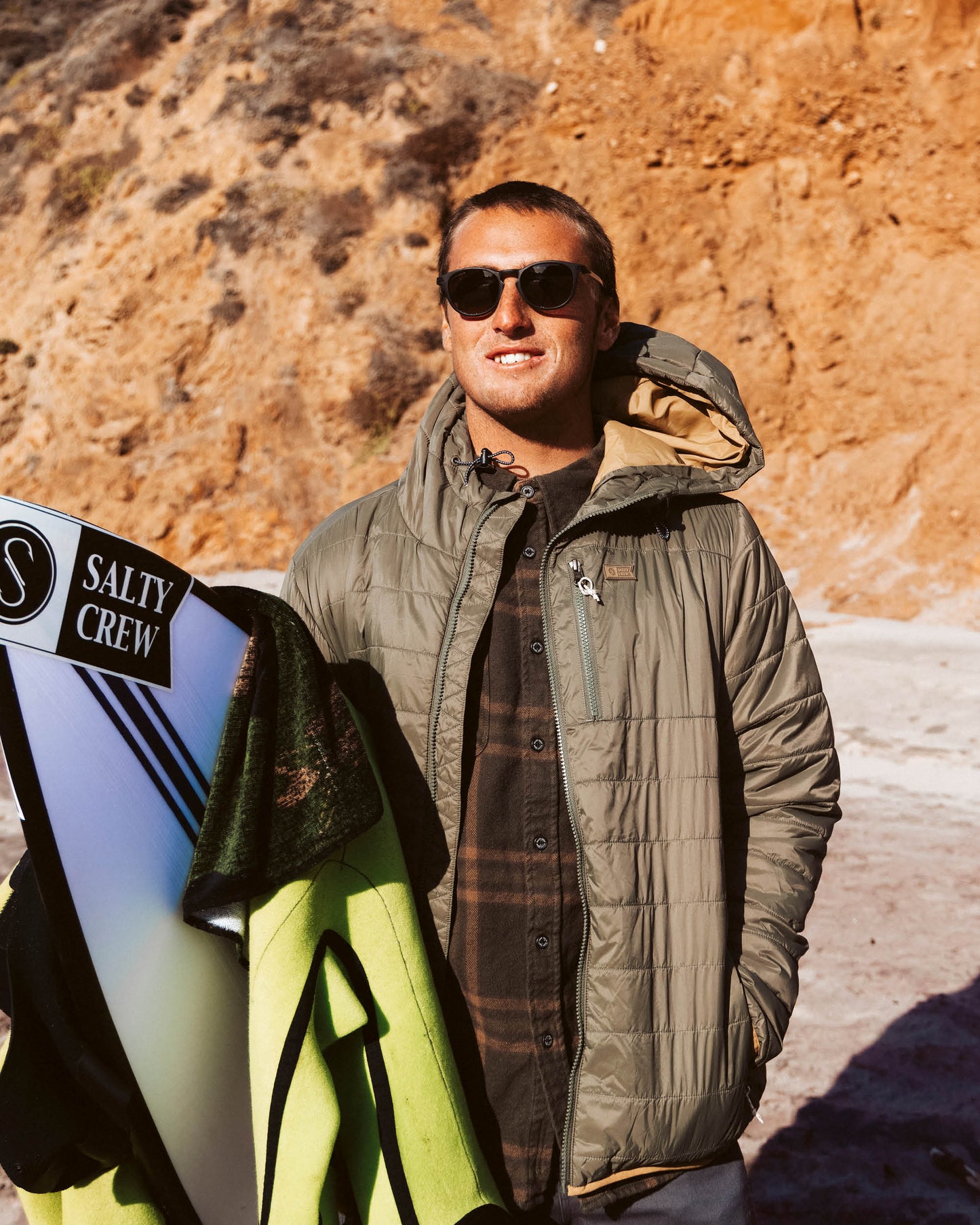 Lifestyle shot of the Barrier Jacket - Olive. 