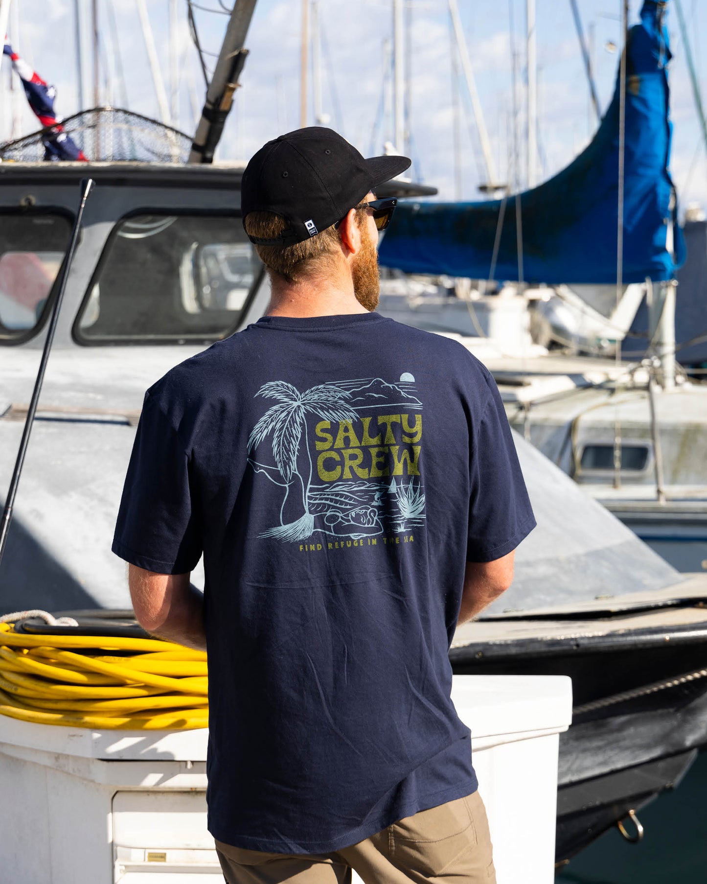 Lifestyle shot of the Legs Premium Tee - Navy. 