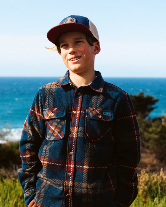 Lifestyle shot of the Swellter Boys Polar Fleece - Navy. 