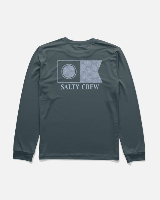 The Salty Crew Flagship Fill Boys Long Sleeve Sunshirt in navy features a light blue flag graphic with a palm pattern, SALTY CREW text printed on the back, and is made from moisture-wicking, 4-way stretch fabric for all-day comfort.