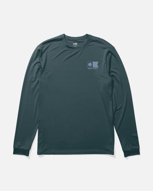 The Salty Crew Flagship Fill Long Sleeve Sunshirt in navy features a small blue logo and Salty Crew text on the left chest. Crafted from moisture-wicking fabric for all-day comfort, this long-sleeve shirt is displayed laid flat on a white background.