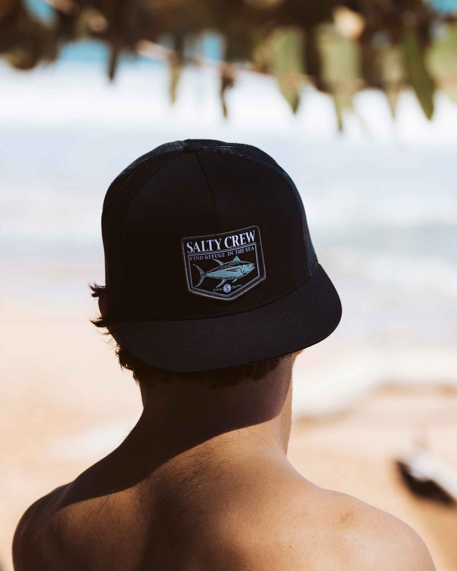 Lifestyle shot of the Angler Black Trucker. 