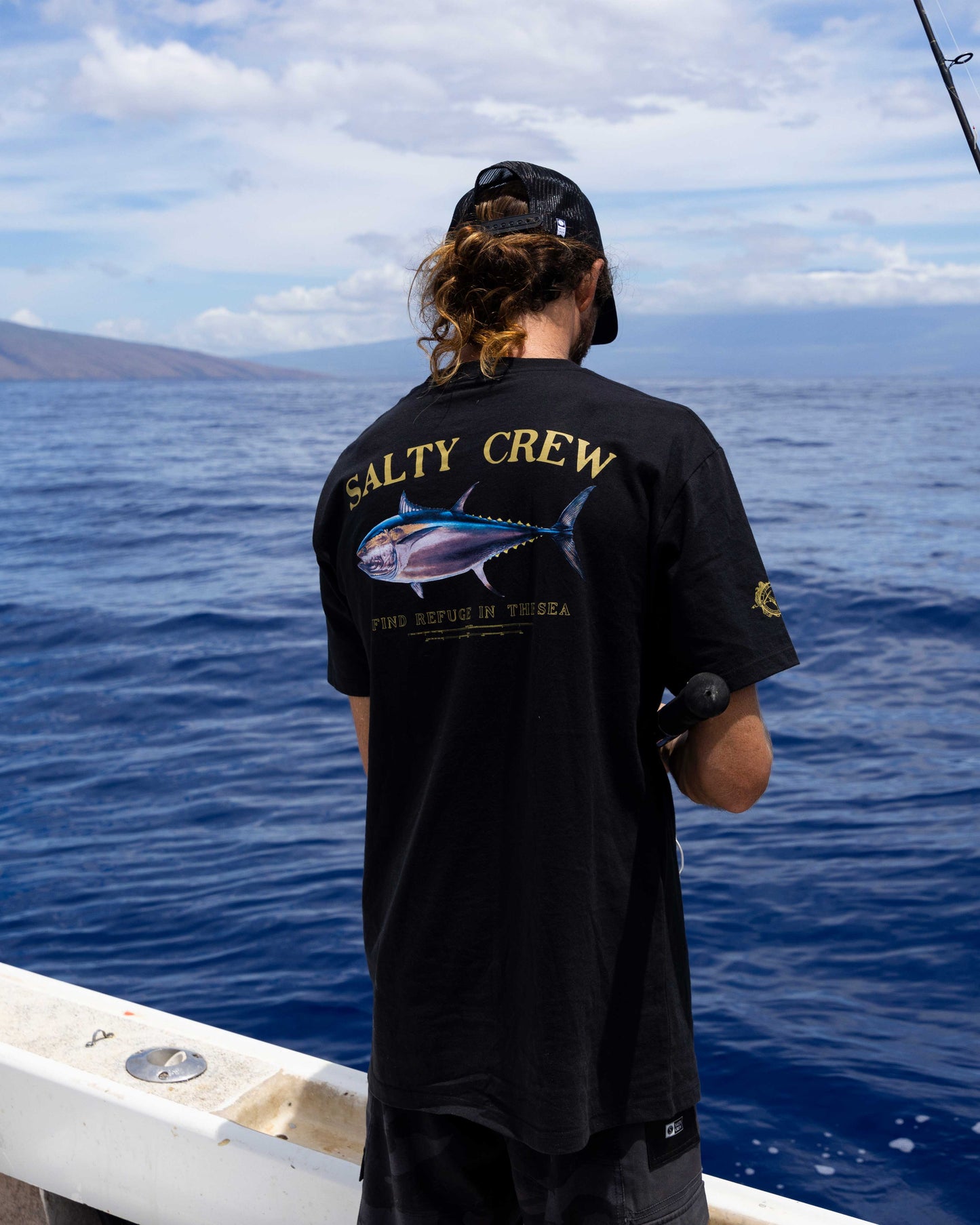 Lifestyle shot of the Big Blue Premium Tee - Black. 