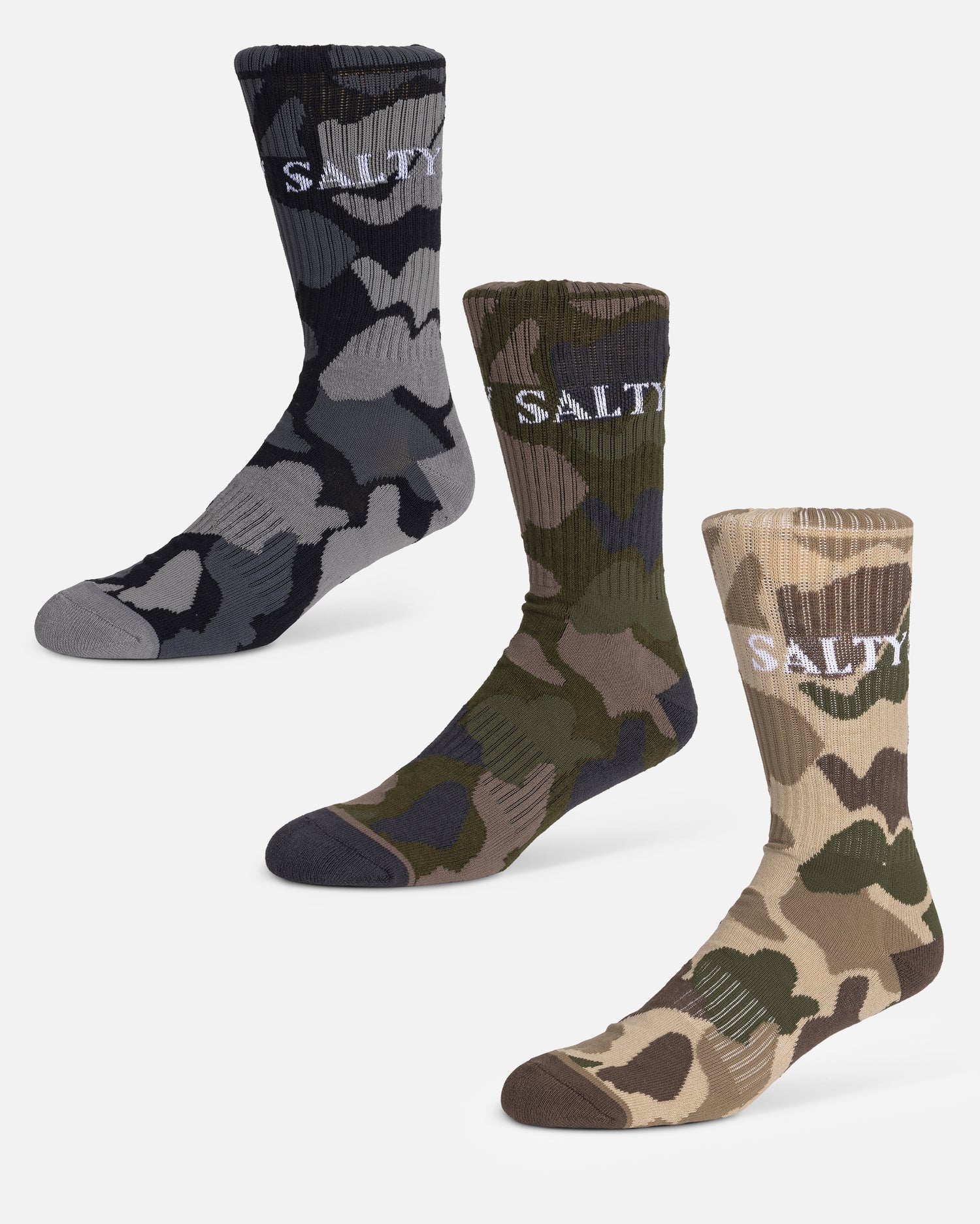 The Salty Crew Camo 3-Pack Sock Box includes three pairs of size 7-11 crew socks in assorted camouflage patterns with "SALTY" embroidered near the top.
