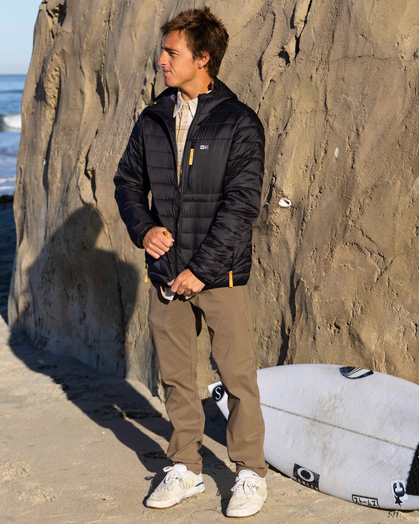 Lifestyle shot of the Midway Tech Pant - Earth. 