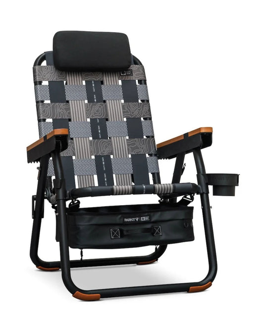 Parkit x Salty Crew Eclipse Recliner chair with a headrest, wooden armrests, woven patterned webbing, and an attached storage bag underneath.