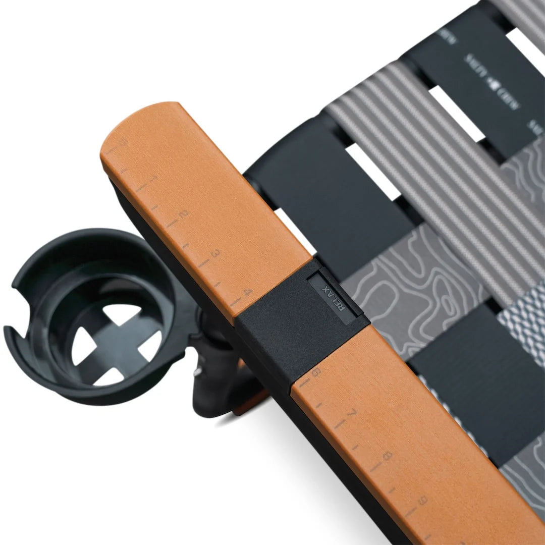Close-up of a Parkit x Salty Crew Eclipse Recliner armrest featuring an integrated cup holder and a built-in ruler marked from one to nine.