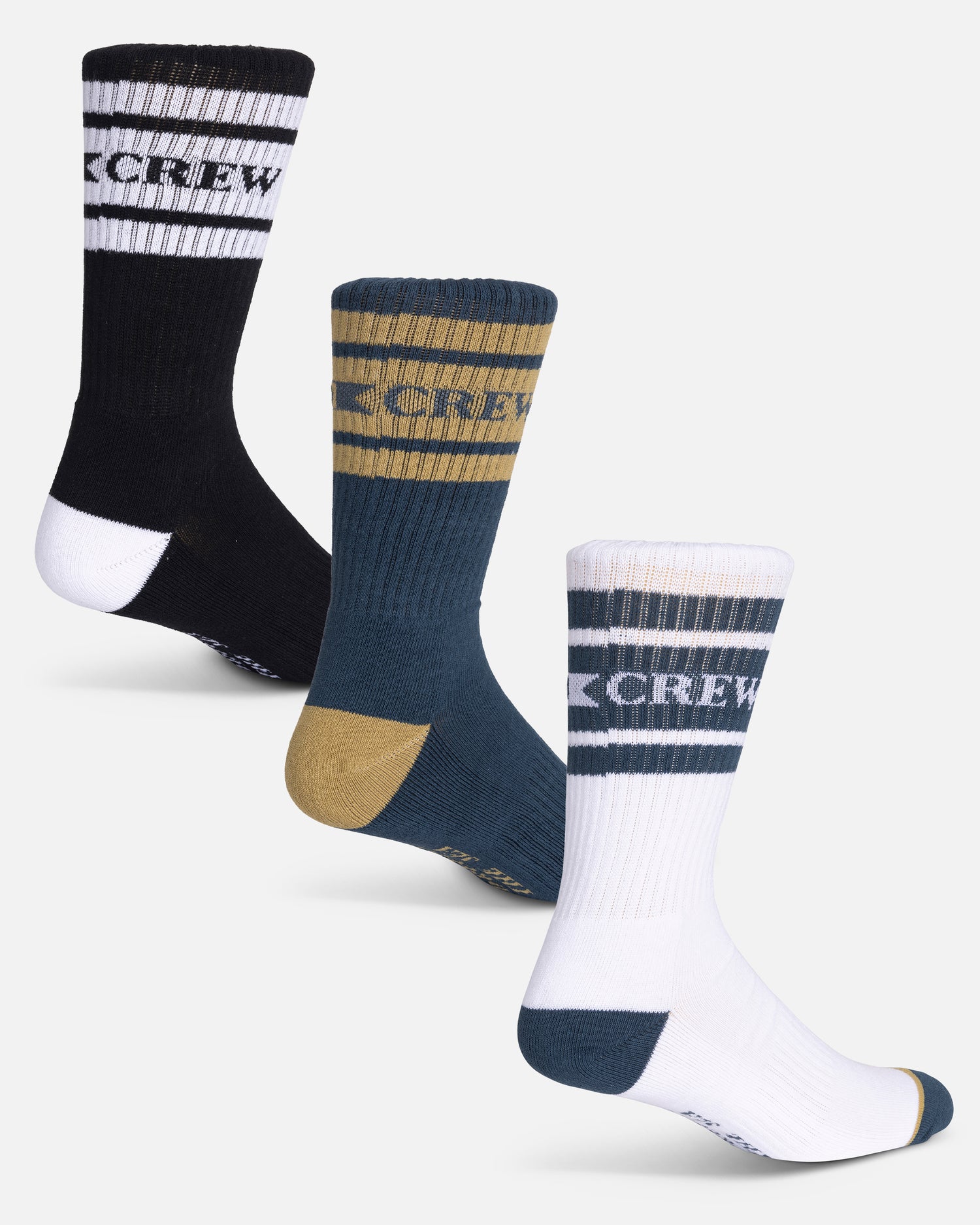 The Salty Crew Flagship 3-Pack Sock Box - Assorted includes three pairs of cotton blend crew socks in black, blue, and white with contrasting stripes, CREW text on the cuffs, reinforced toes and heels, sized 7-11.