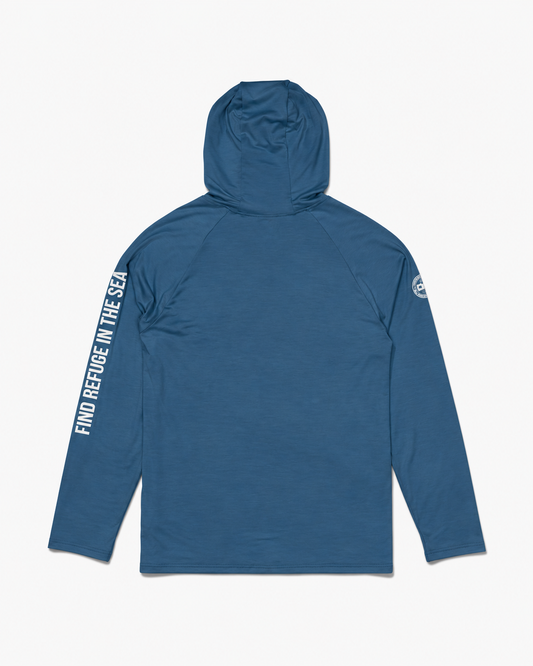 Cast Blue Mariner Lite UV Hood, a lightweight, moisture-wicking long-sleeve shirt with a hood and the text FIND REFUGE IN THE SEA printed vertically down the right sleeve.