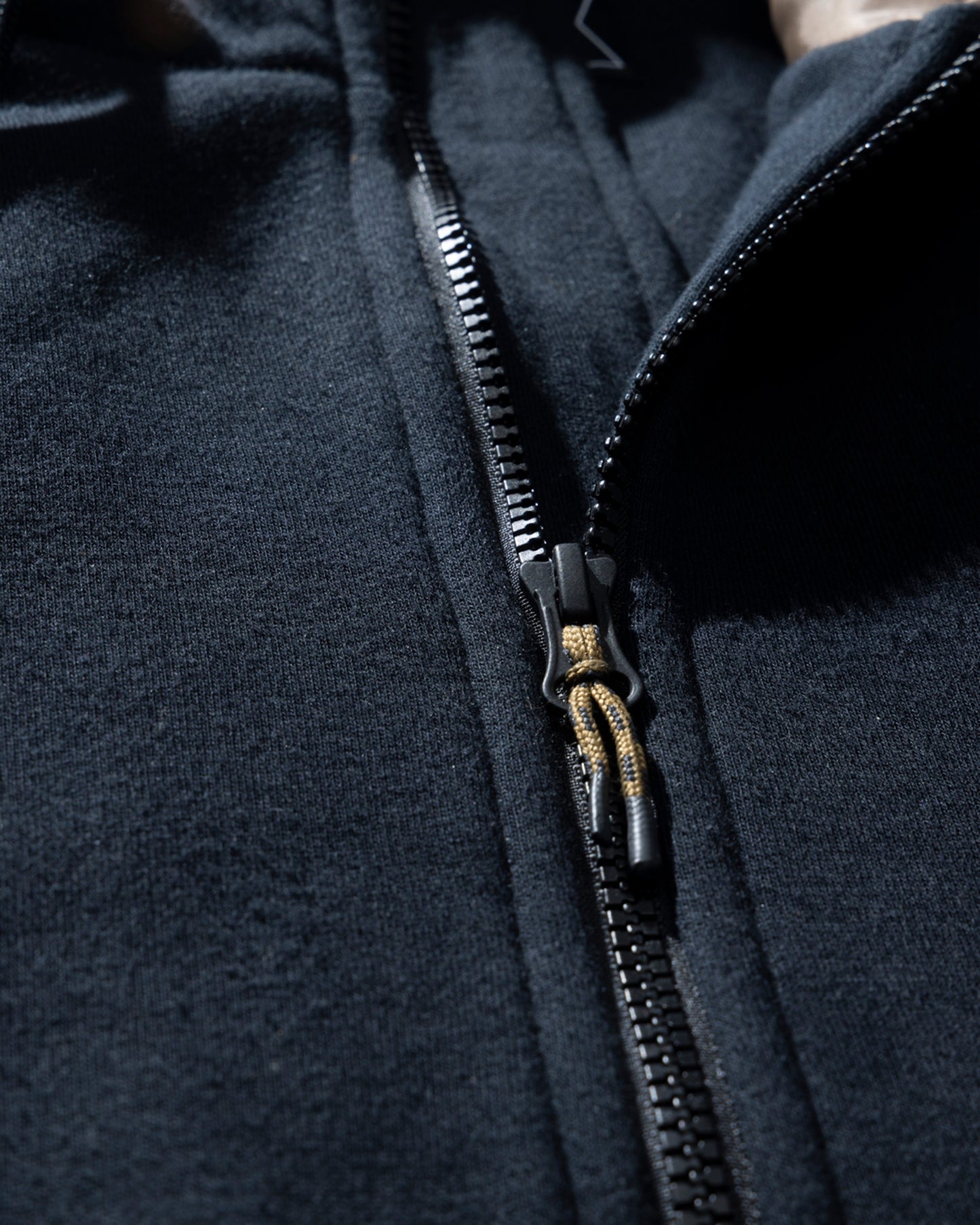 Detail photo of the Westward Tech Fleece Hoodie - Black. 