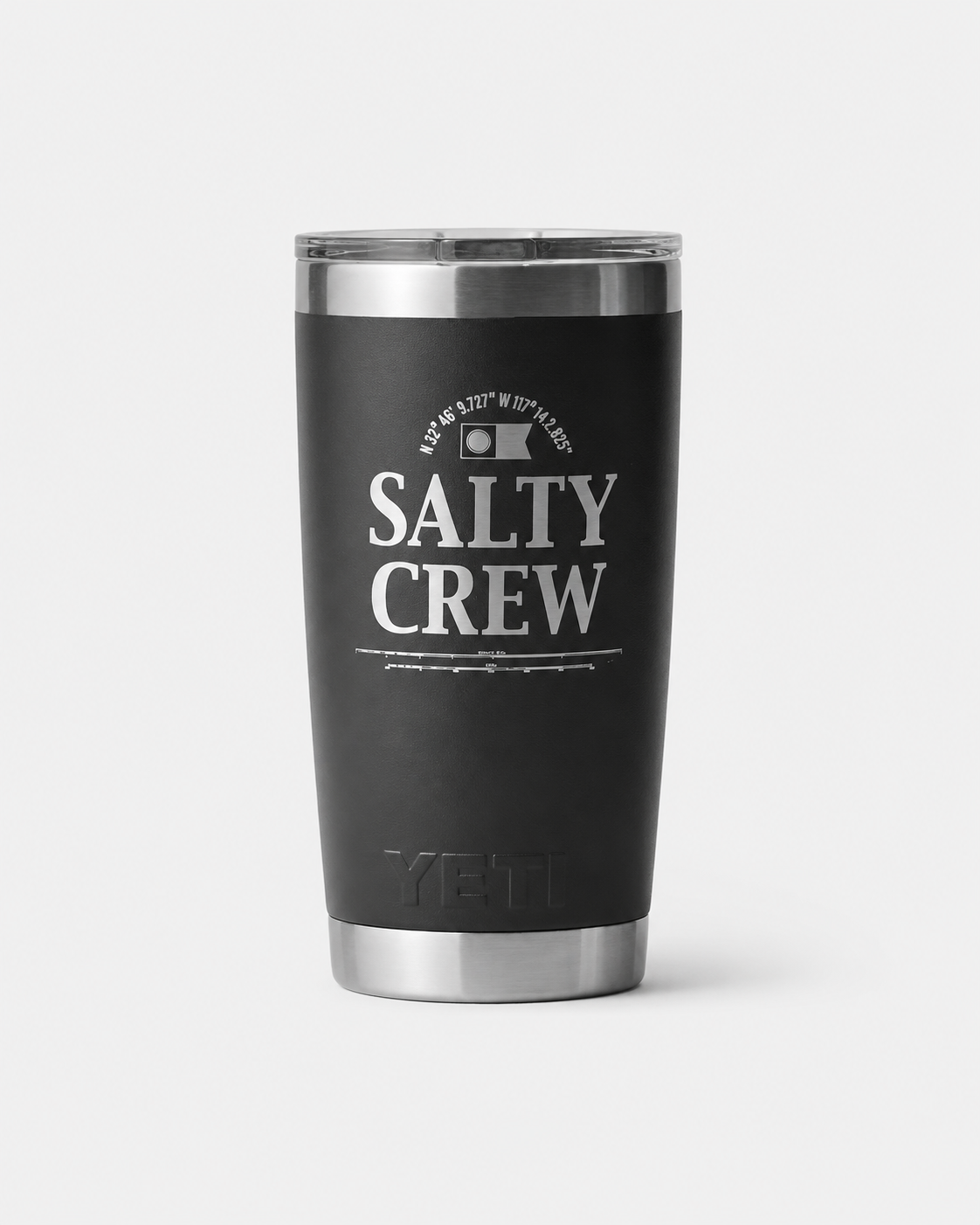 The Salty Crew Yeti x Salty Crew Tumbler 20 Oz in black is a vacuum-insulated stainless steel drinkware with a silver lid, featuring "Salty Crew" and a fish logo printed in white on the front.