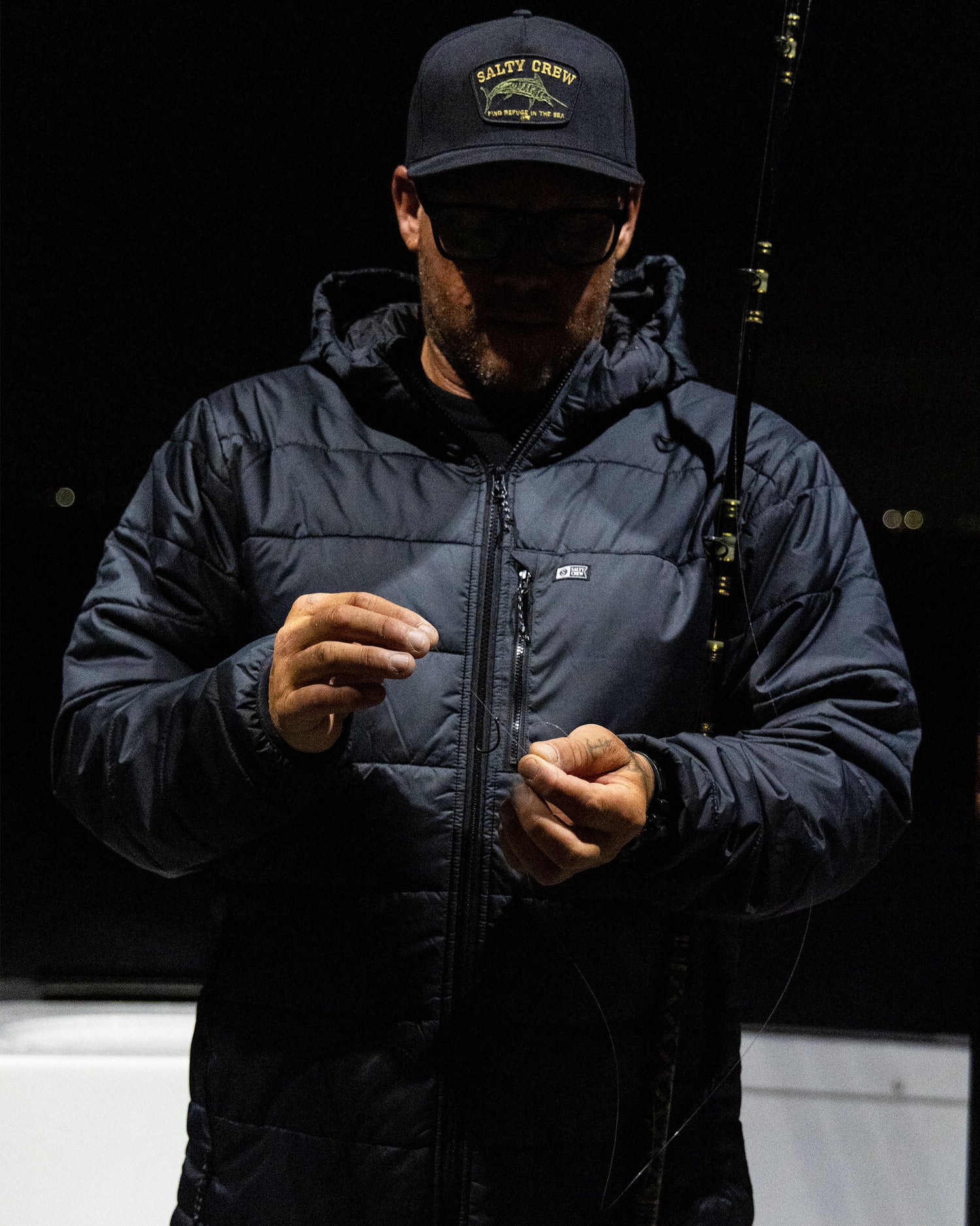 Lifestyle shot of the Barrier Insulated Jacket - Black. 