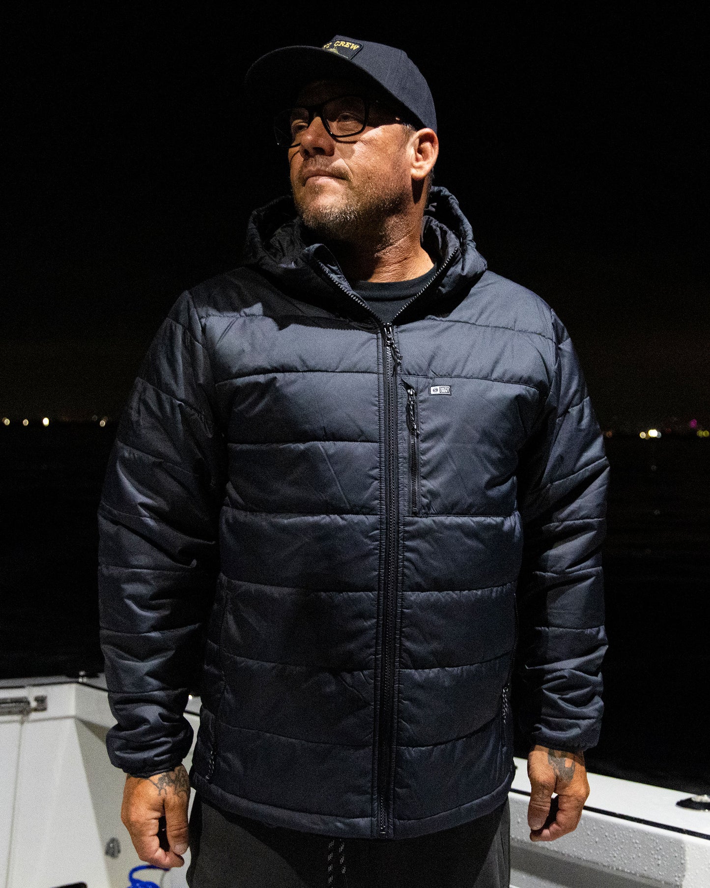 Lifestyle shot of the Barrier Insulated Jacket - Black. 