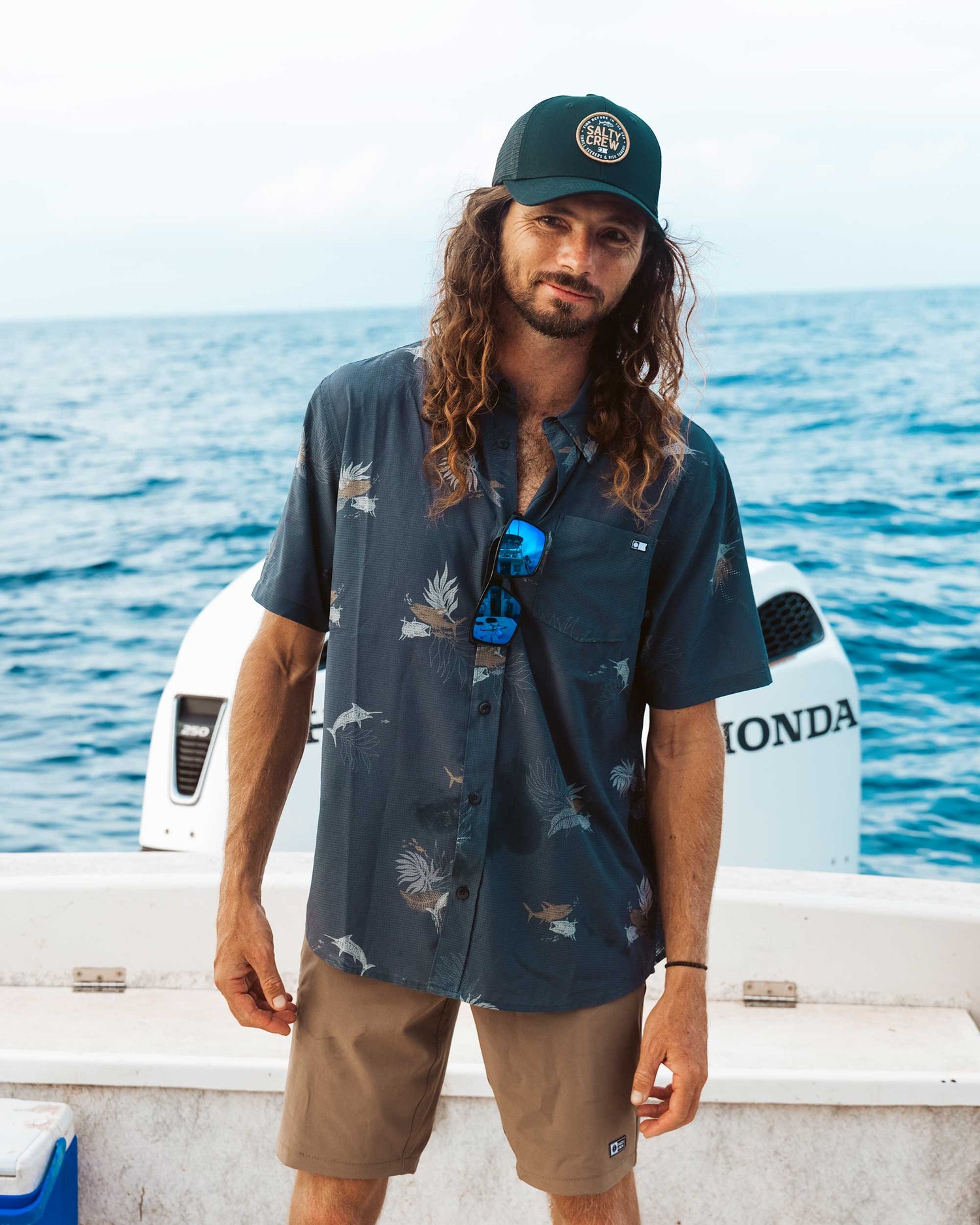 Lifestyle shot of the Breezer Perforated Button Up - Charcoal. 